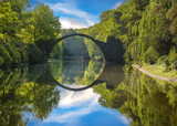 Fototapeta Do pokoju - Bridge in rhododendron park in Kromlau, Germany
