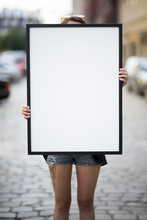 Poster Mockup - Girl Holds A Frame With A Blank White Copy Space