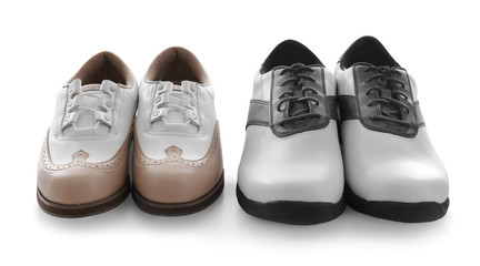 Canvas Print - Two pairs of leather golf shoes on white background