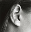 © Amsterdam/Stocksy - close-up of ear