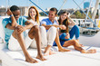 © BONNINSTUDIO/Stocksy - Group of young friends enjoying a summer sunny day on a luxurious yacht.