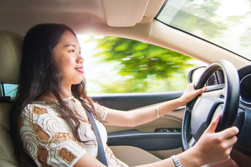 Asian girl driving a car