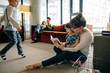 © Stocksy - Young mom teaching little girl to read inside