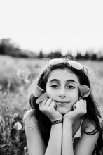 Black And White Portrait Of A Girl Looking At Camera Outdoors