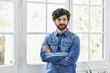 © ALTO IMAGES/Stocksy - Handsome Man Standing Arms Crossed At Home