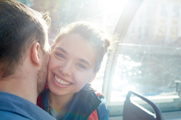 Canvas Print - Laughing girl looking at camera with her boyfriend cheek by cheek