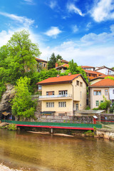 Wall Mural - View of the architecture and embankment of the Milyacki River in the historical center of Sarajevo, Bosnia and Herzegovina