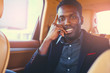 © Fxquadro - Stylish Black male in a luxury car.