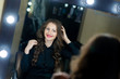 © fotofrol - Beautiful girl makeup artist near mirrors