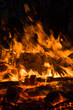 © dotcomphoto - burning wood closeup in real; firereal fire flame render, bonfire campfire\ camp fire hot orange flame.