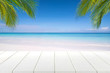 © satit - white wooden table and beautiful sea in summer.