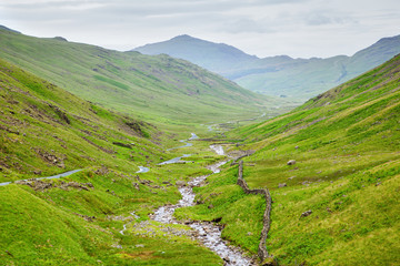 Wall Mural - Beautiful views in Lake District National Park, England, mountains on the background, selective focus