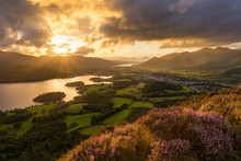 Sun Setting Behind Moody Clouds With Dramatic Evening Light In The English Lake District.