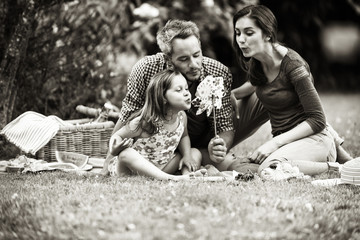 Sticker - Cheerful family sitting on the grass during a picnic