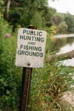 Public Hunting And Fishing Groungs Sign By A Lake