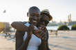 © WAVE/Stocksy - Affectionate young couple having fun outdoors