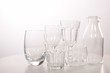 © Kinga - Empty crystal glasses and glasses and a bottle