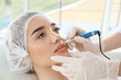 © Africa Studio - Young woman having permanent makeup on lips in beautician salon