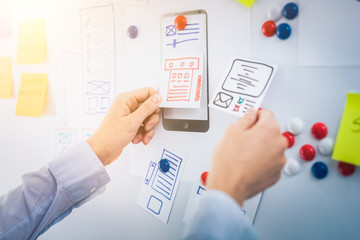 Designer drawing website ux app development.
