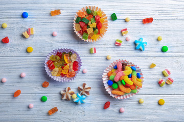 Sticker - Composition with tasty candies on table