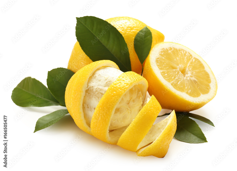 Delicious citrus fruit and green leaves on white background