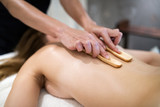 Fototapeta Sypialnia - Thai massage therapist treating patient