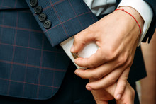 Hands Of Groom In A White Shirt Dress Cufflinks