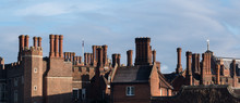 Chimneys And Parapets On Tudor Architecture Red Brick Building Skyline