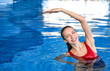 © Africa Studio - Beautiful young woman exercising in swimming pool