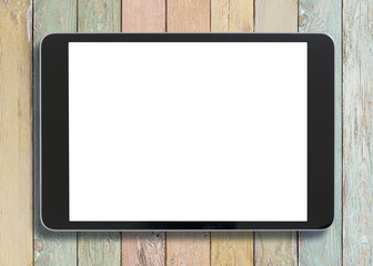 Black tablet pc looking similar to ipad on old colorful wood background