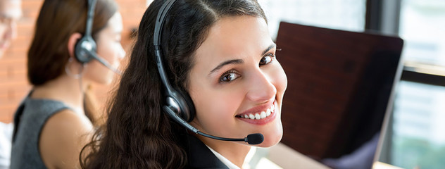 Smiling telemarketing customer service agents, call center job concept