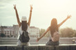 © djoronimo - Two happy women are having fun together in the city in summer.