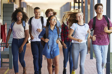 teenager school kids running in high school hallway