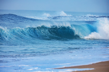 Wall Mural - sea waves in storming water on blue background