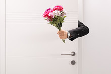 Person Giving A Flower Bouquet