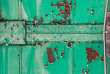 Fototapeta Młodzieżowe - close up of green metal bridge structure for support trains with rust