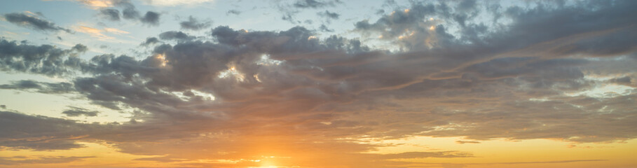 Wall Mural - Fiery sunset, colorful clouds in the sky