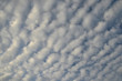 Alto cumulus radiatus clouds in a sky with no foreground.