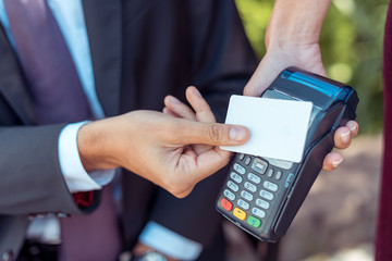 man using contactless credit card