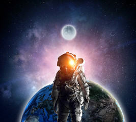 Wall Mural - astronaut explorer in space. mixed media