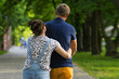 © KaroKatitca - Young couple walking with child in the Park. Summer.