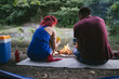 © hedgehog94 - Young happy couple enjoying camping and hiking in wild nature.