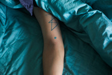 Tattoo Of A Blue Snowflake - Horizontal