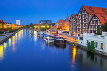 Architecture Of Bydgoszcz City With Reflection In Brda River At Night, Poland