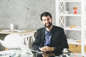 Wall Mural - Smiling businessman in office