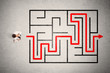 © ra2 studio - Lost businessman found the way in maze with red arrow