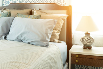 Wall Mural - classic style bedroom with blue pillows and chinese lamp style on bedside table