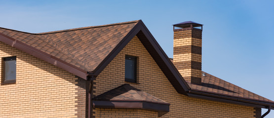 house with a gable roof window