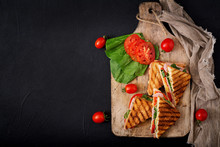 Club Sandwich Panini With Ham, Tomato, Cheese And Basil. Flat Lay. Top View