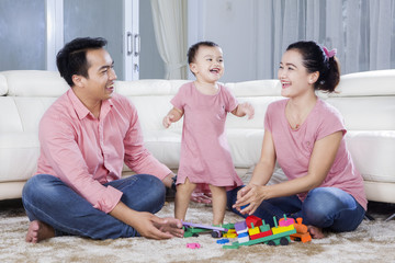 Wall Mural - Family playing together at home